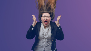 woman with glasses screaming isolated on purple background