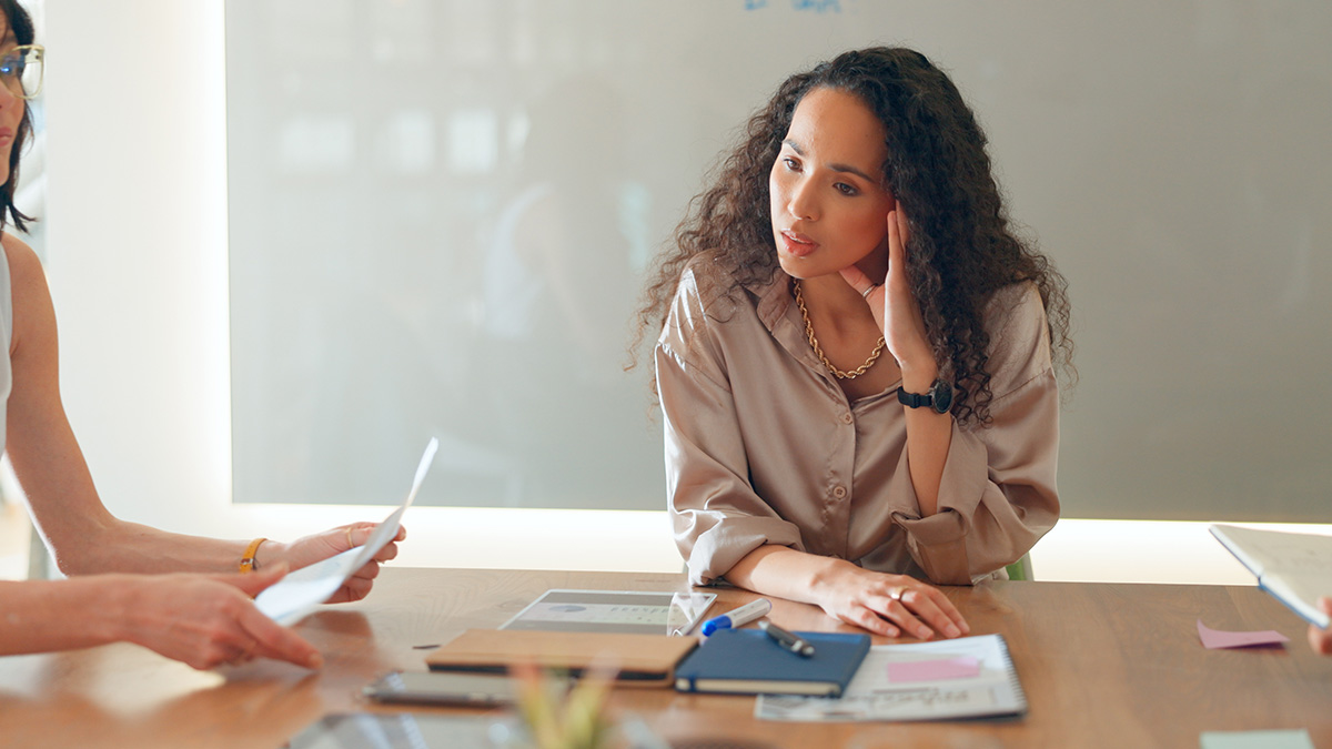 Stressed businesswoman sitting at a table