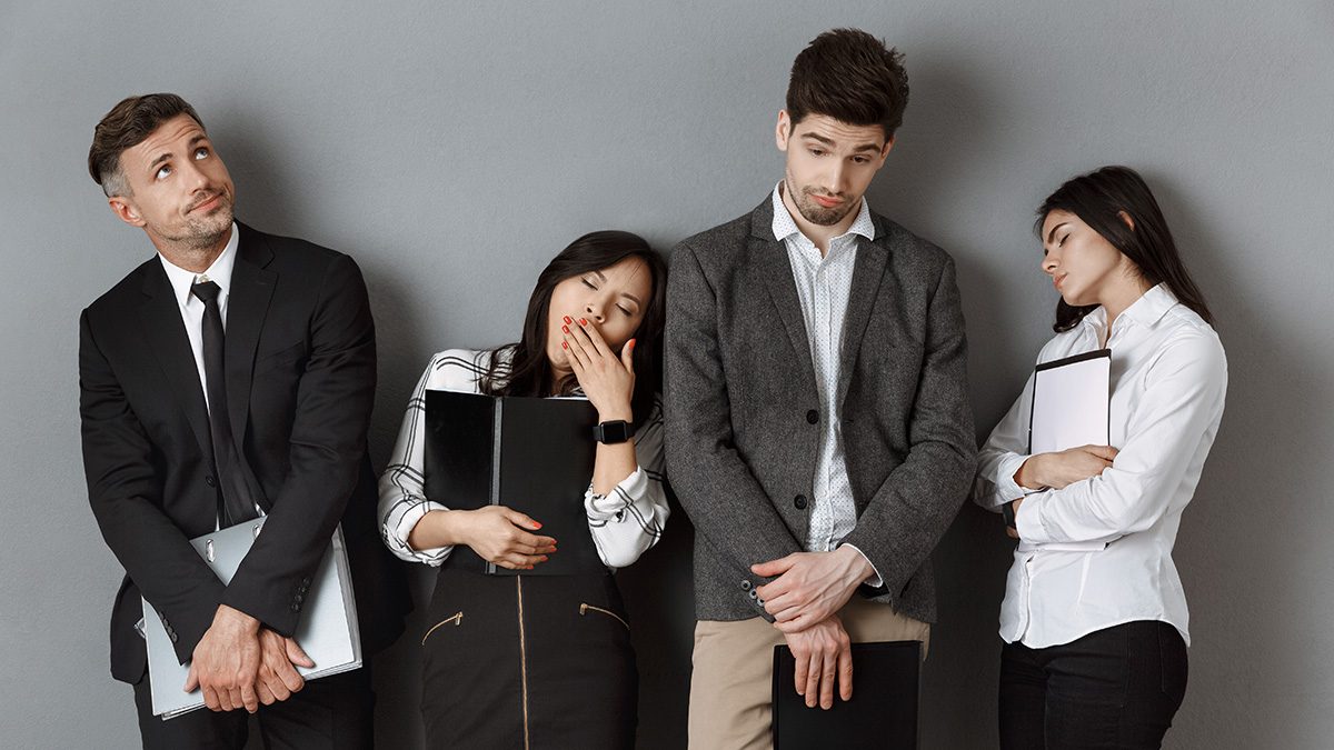 Bored people in business atire on a grey background