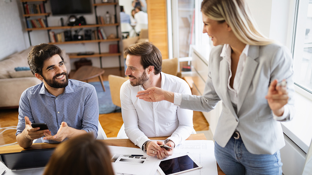 Businesswoman talking to colleagues