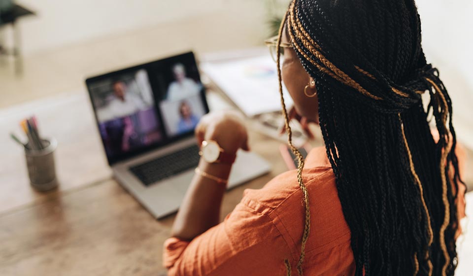 Woman watching a learning module on her laptop